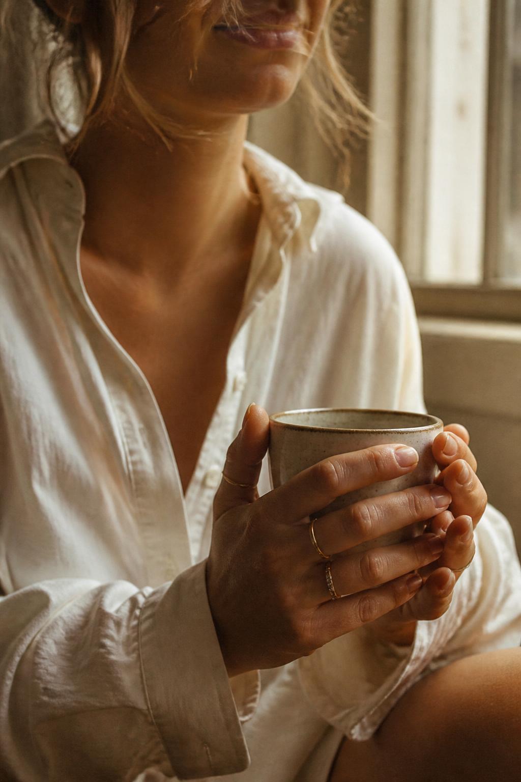 Intimate lifestyle portrait in warm window light